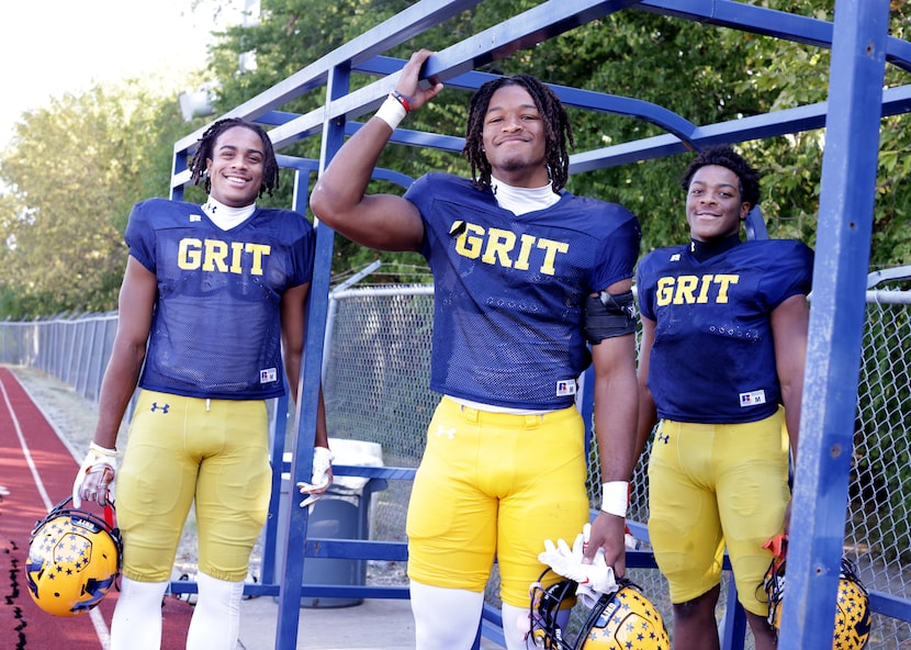 Kailer Pettijohn, left, Riley Pettijohn, and Cam Pettijohn pose for a photograph at the...