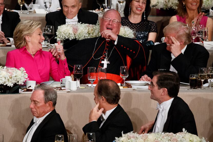 Republican presidential candidate Donald Trump, right, Cardinal Timothy Dolan, Archbishop of...