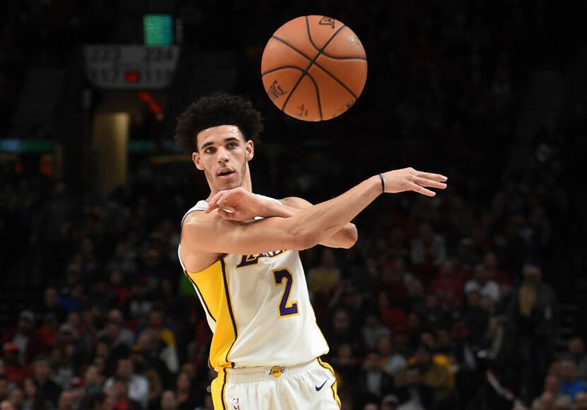 Los Angeles Lakers guard Lonzo Ball passes the ball during the first quarter of the team's...