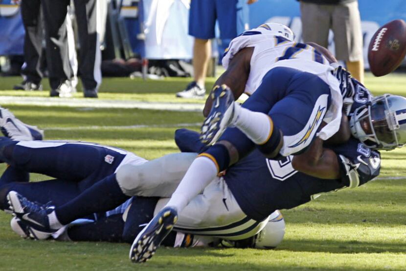 Dallas Cowboys wide receiver Terrance Williams (83) fumbles at the goal line as he is hit by...