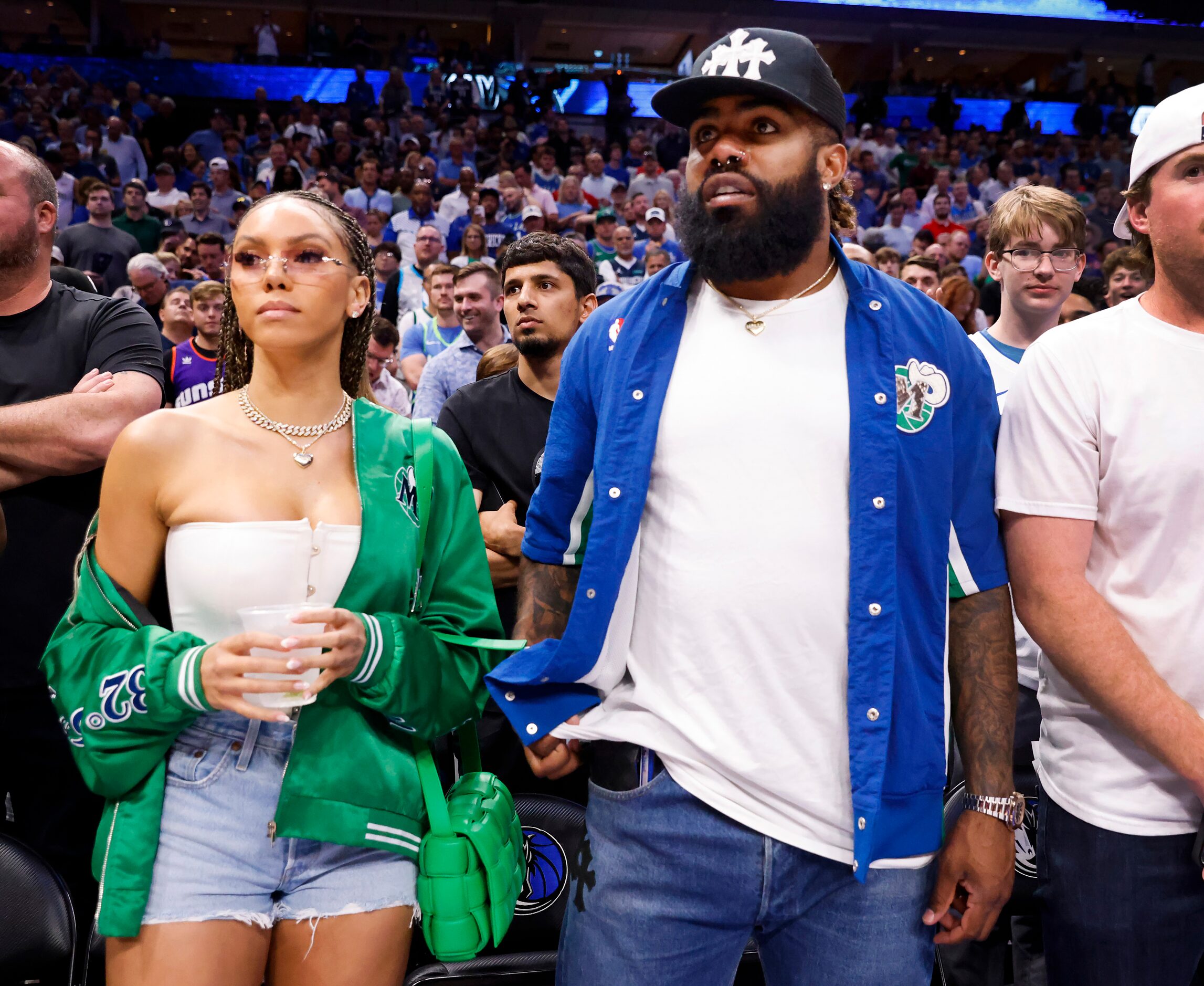 Dallas Cowboys running back Ezekiel Elliott (right) was on the sideline for Game 6 of a NBA...