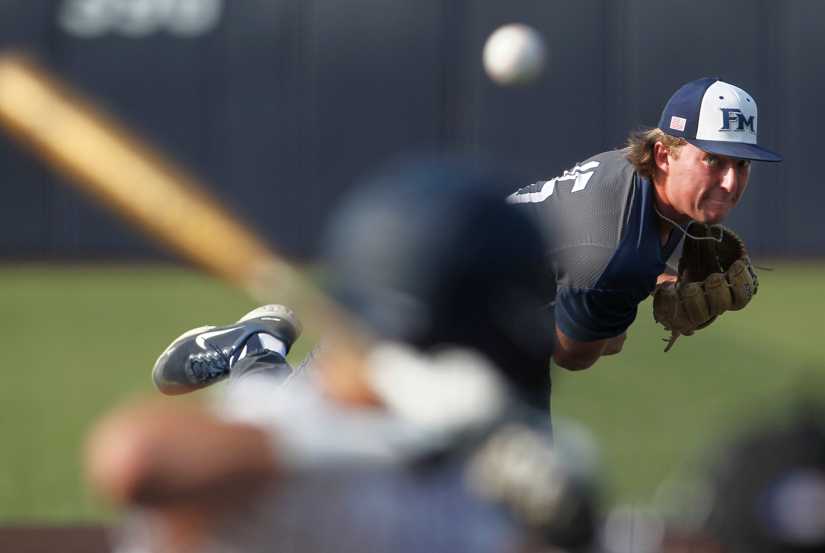 Flower Mound pitcher Josh Glaser (15) delivers a pitch to a Keller batter in the bottom of...