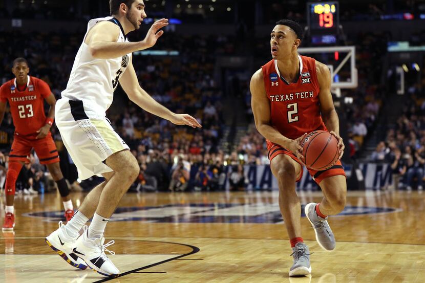 BOSTON, MA - MARCH 23: Zhaire Smith #2 of the Texas Tech Red Raiders is defended by Dakota...