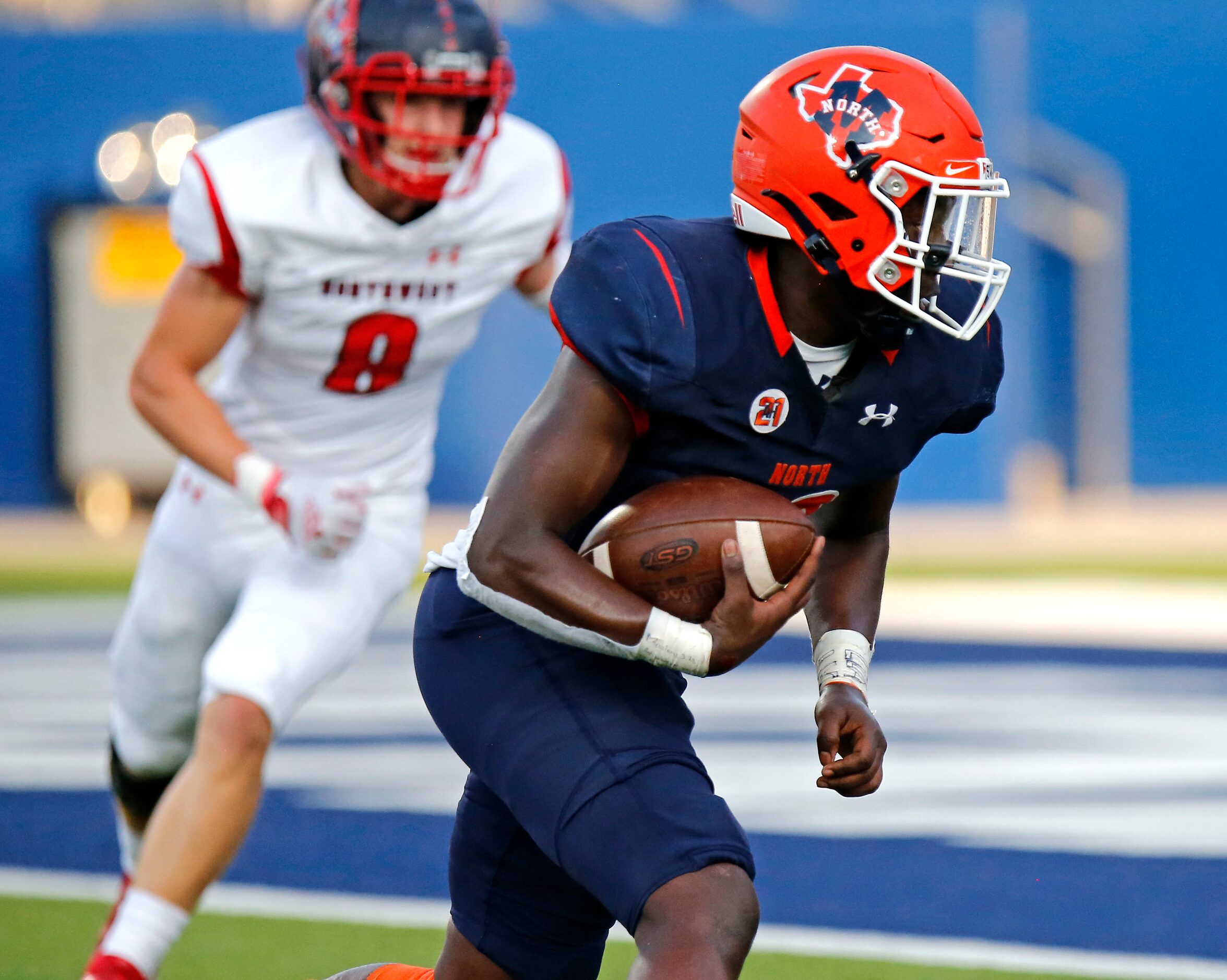 McKinney North High School running back Elijiah Alexander (20) scores a touchdown on this...