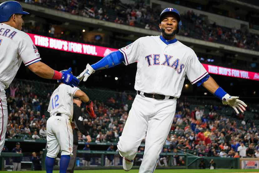 Texas Rangers shortstop Elvis Andrus celebrates with third baseman Asdrubal Cabrera after...