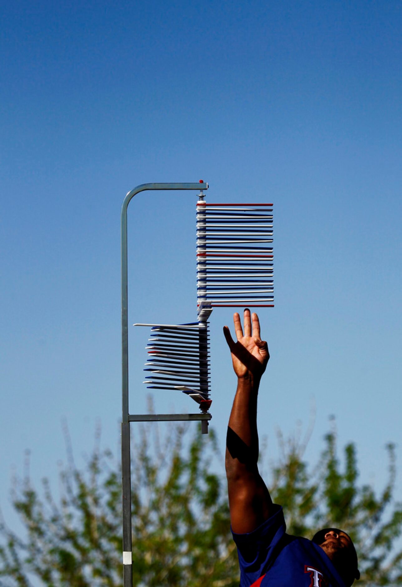 Texas Rangers infielder Adrian Beltre tests his vertical leap during spring training camp...