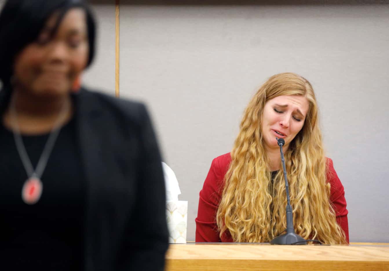 Alexis Stossel cries Wednesday while reminiscing about Botham Jean, her close friend from...