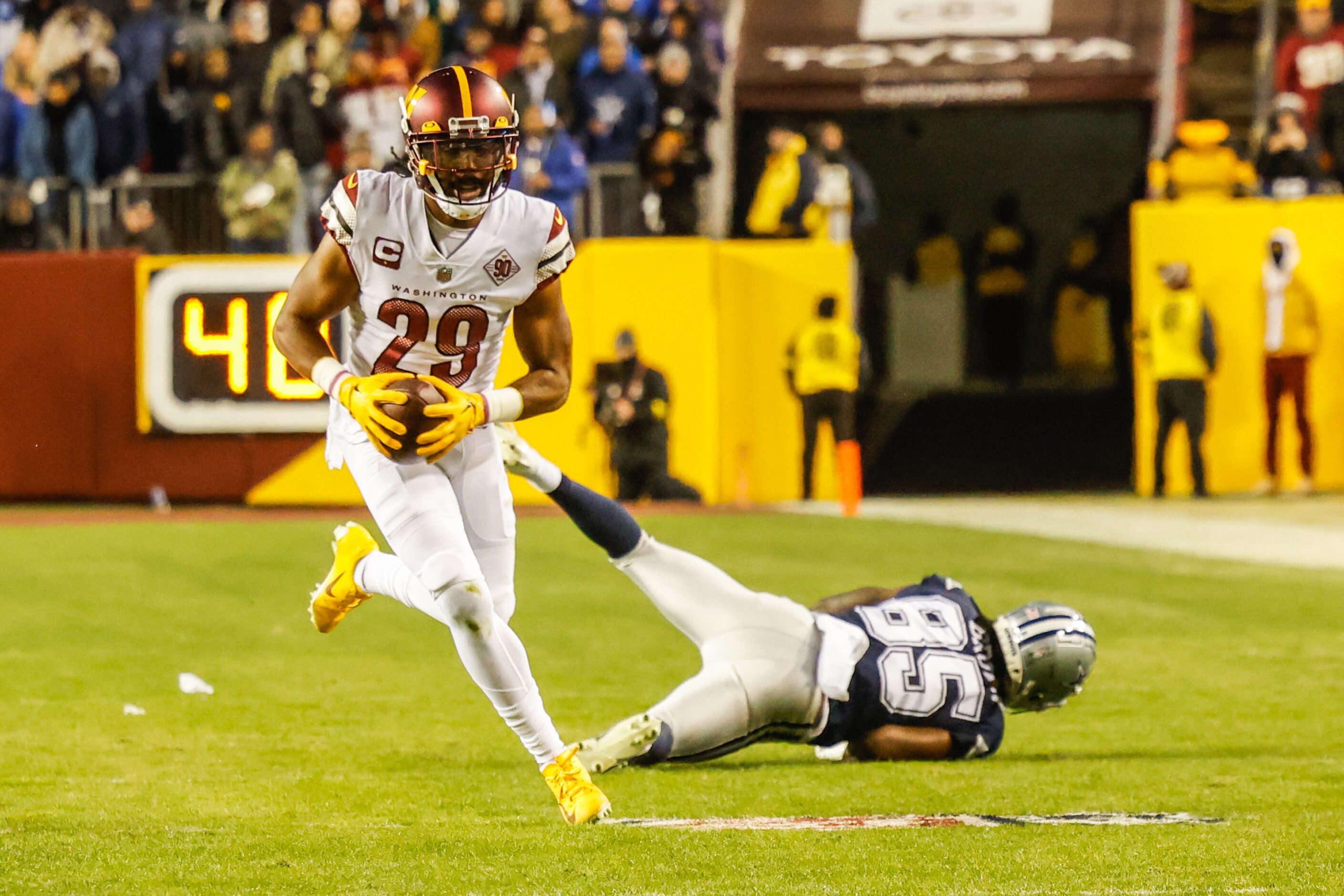 Washington Commanders cornerback Kendall Fuller (29) intercepts a pass to Dallas Cowboys...