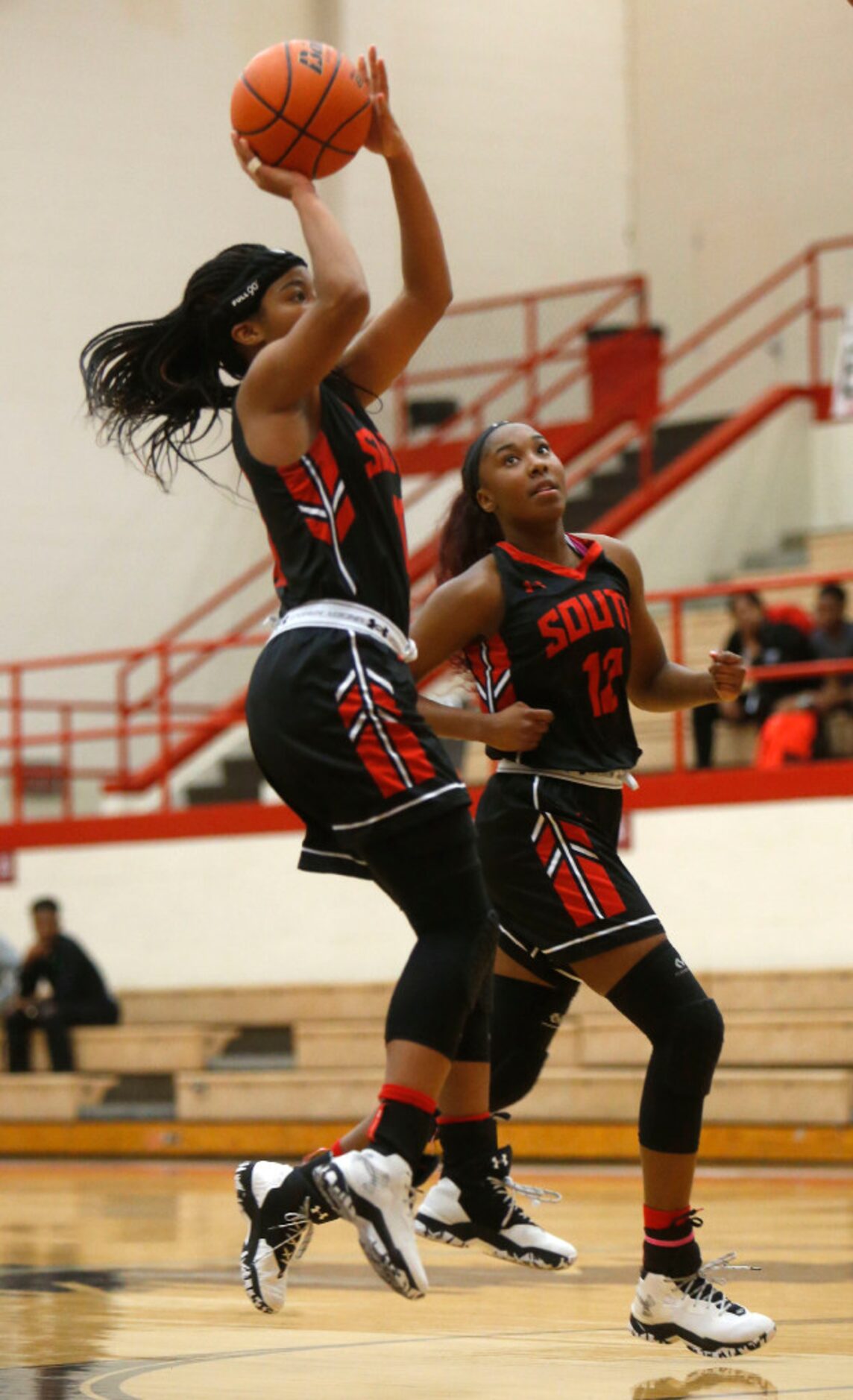 South Grand Prairie player Kamryn Arrington (10) lays up a shot against Cedar Hill during...