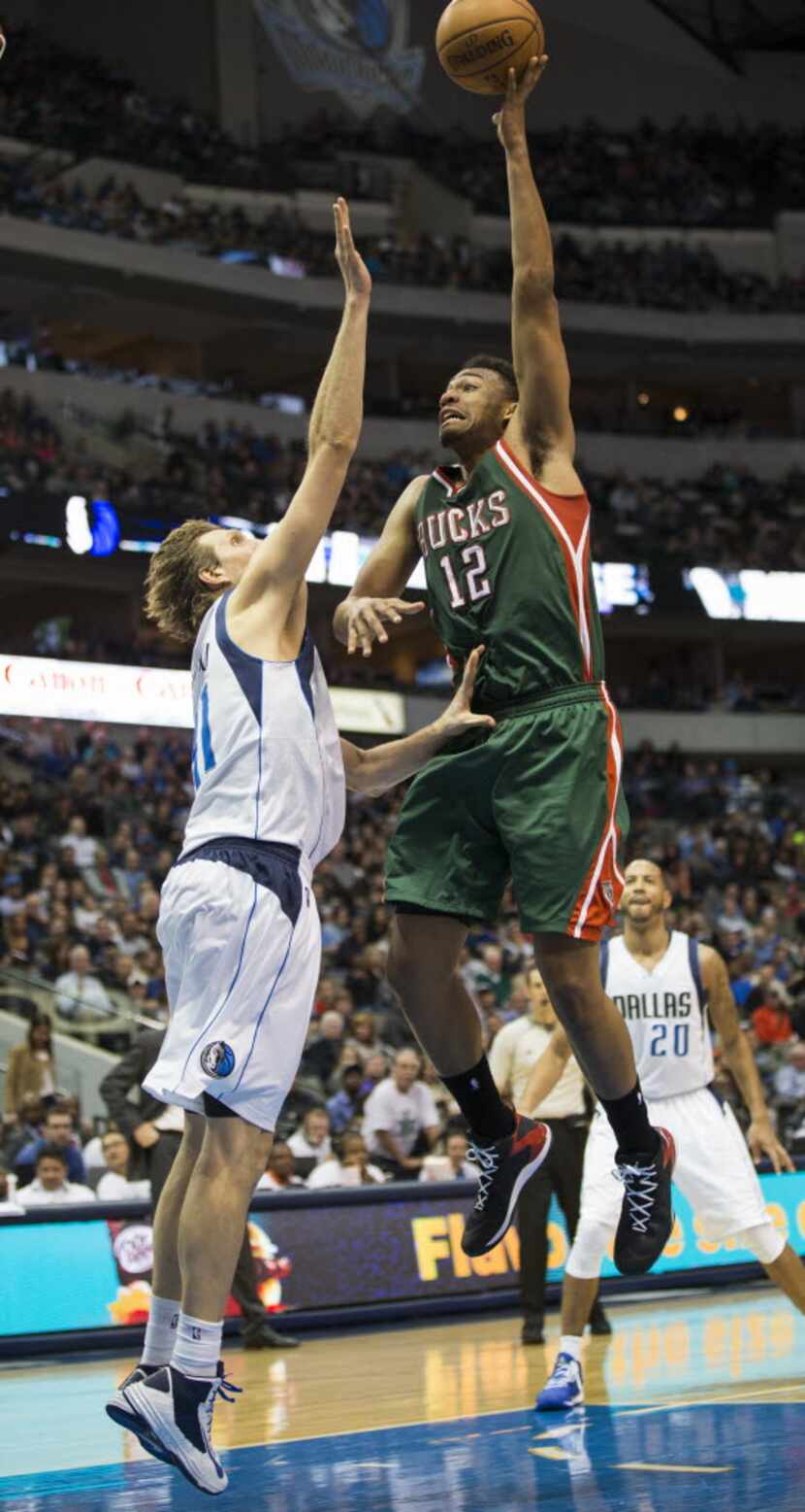 Dallas Mavericks forward Dirk Nowitzki (41) pressures Milwaukee Bucks forward Jabari Parker...