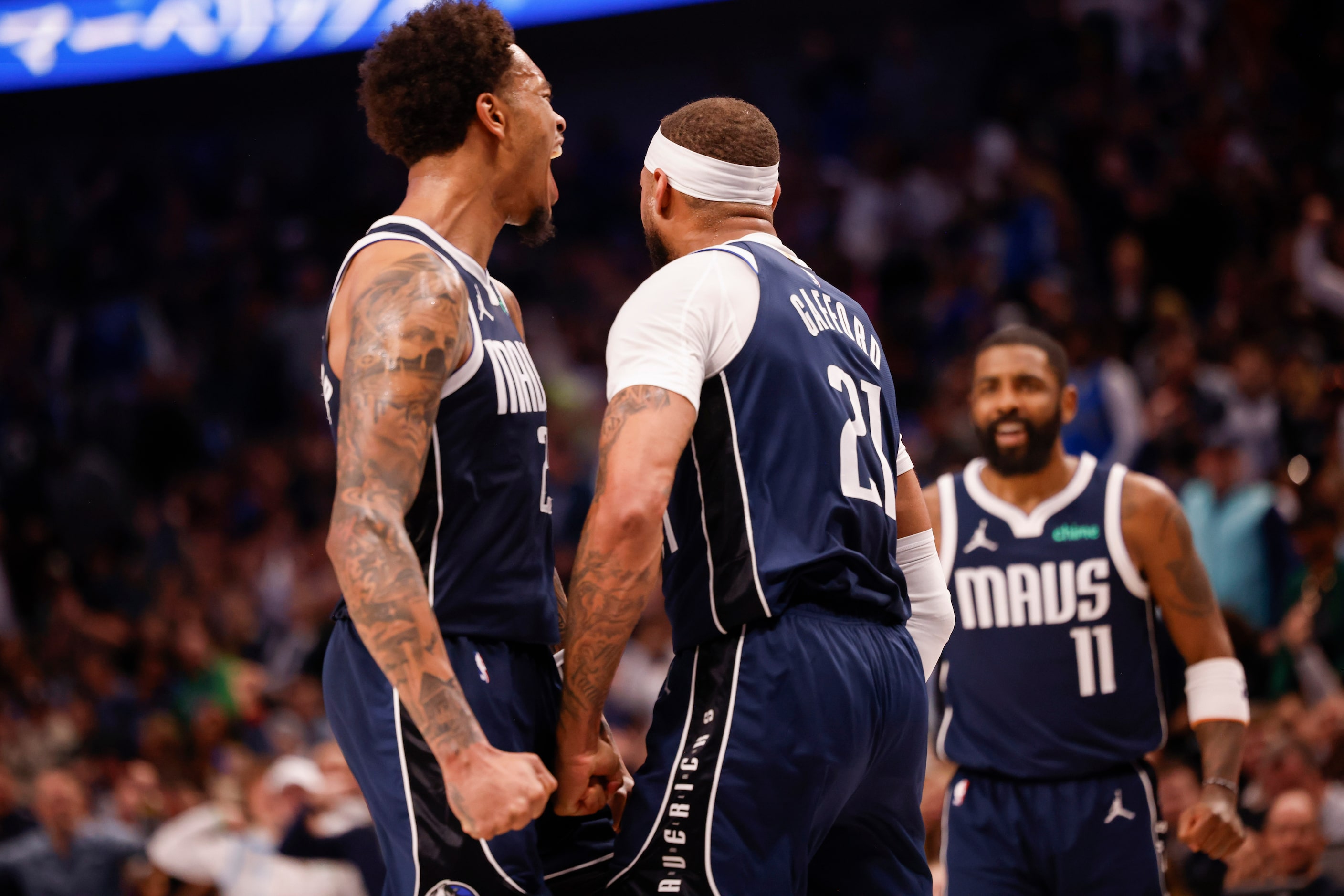 Dallas Mavericks forward P.J. Washington (25) celebrates Dallas Mavericks center Daniel...