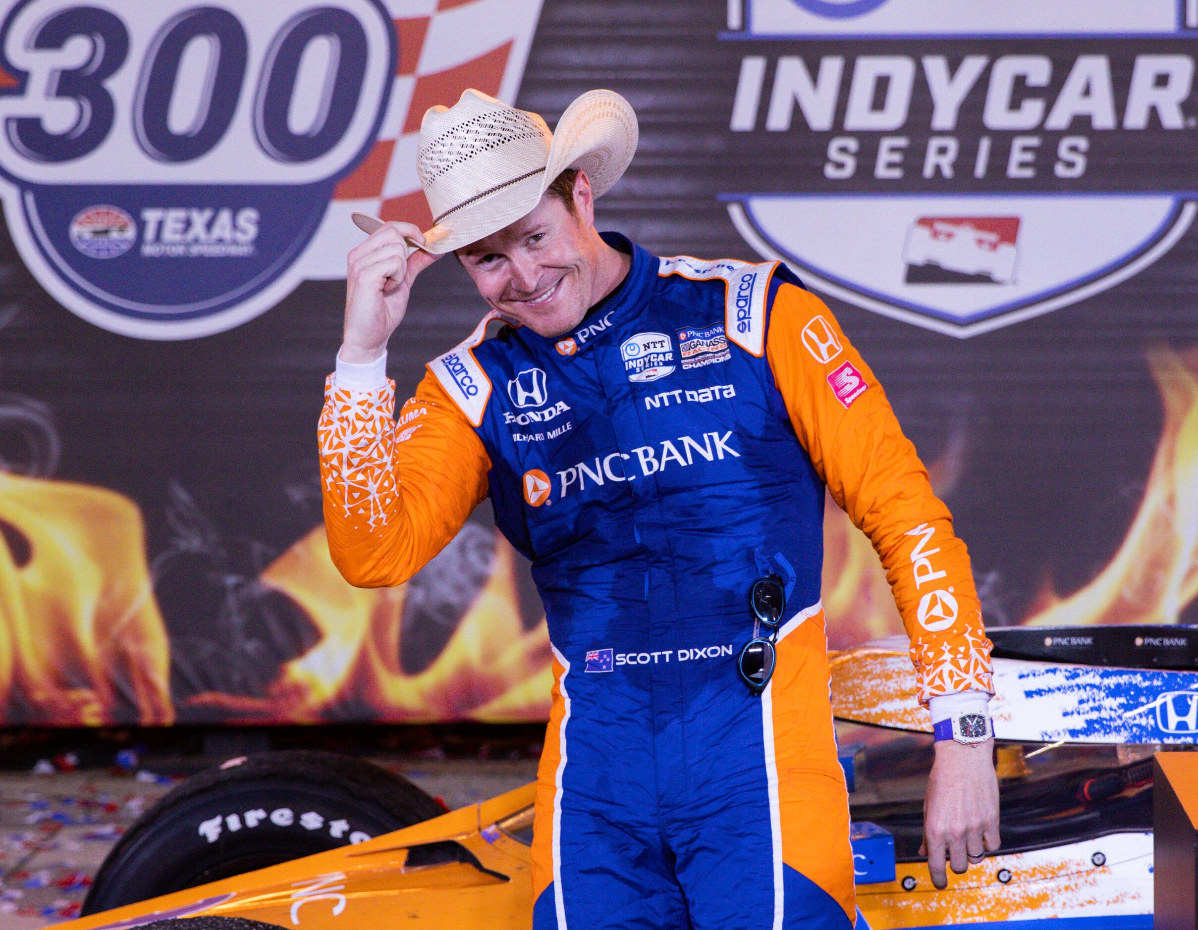 Scott Dixon (#9) celebrates in Victory Lane after winning the IndyCar Genesys 300 race at...