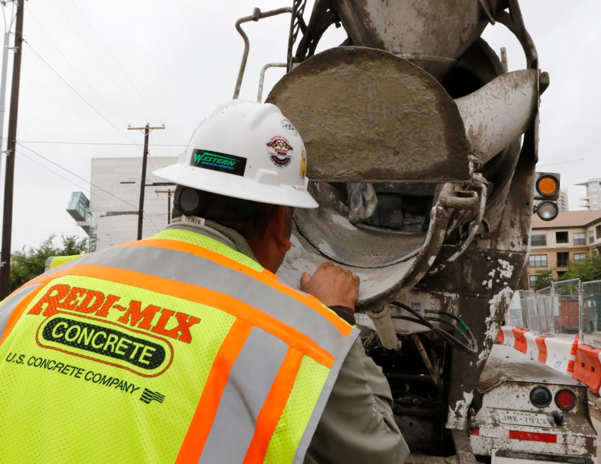 Joe Martinez, project manager for Redi-Mix Concrete, checks the product at The Union Dallas...