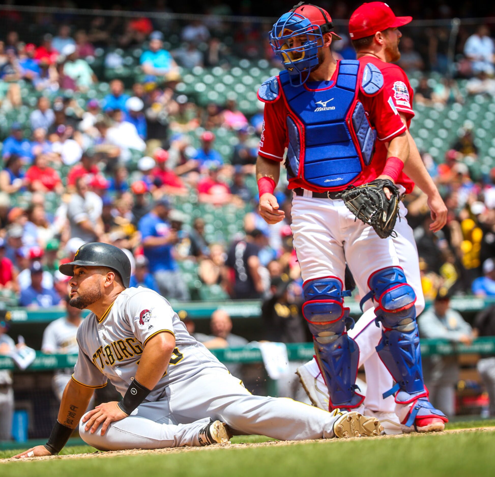 Texas Rangers catcher Jeff Mathis (2) looks down onto Pittsburgh Pirates center fielder...