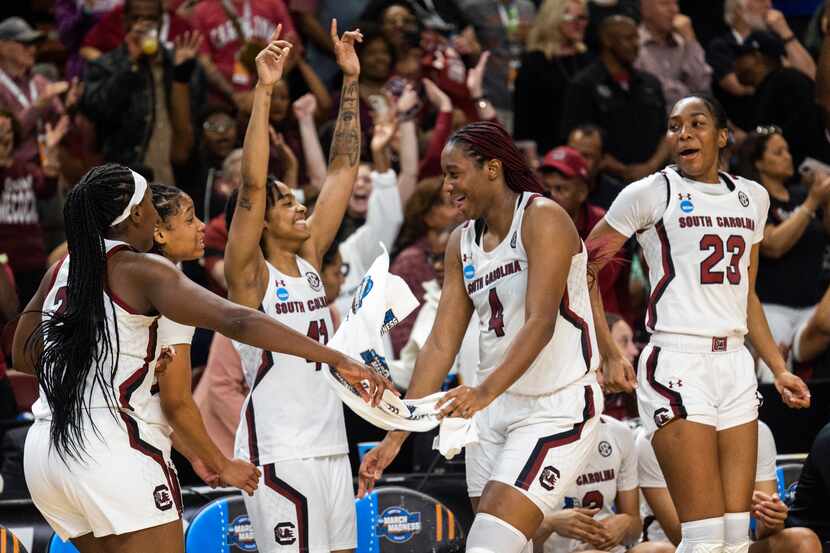 South Carolina's Aliyah Boston (4) celebrates with other players moments before defeating...