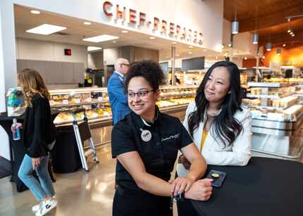 Central Market sales specialist Yesica Hernandez, center, and store general manager Lily...