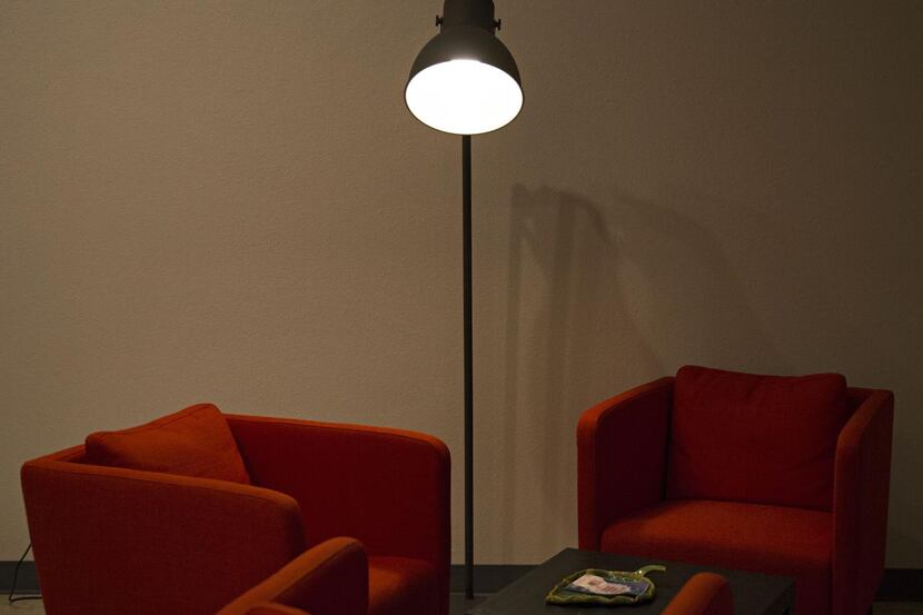 
A lamp illuminates chairs in a meeting space at The Mix Coworking and Maker Space  in the...