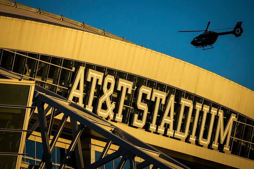 A helicopter flies over the stadium before an NFL wild-card playoff football game between...