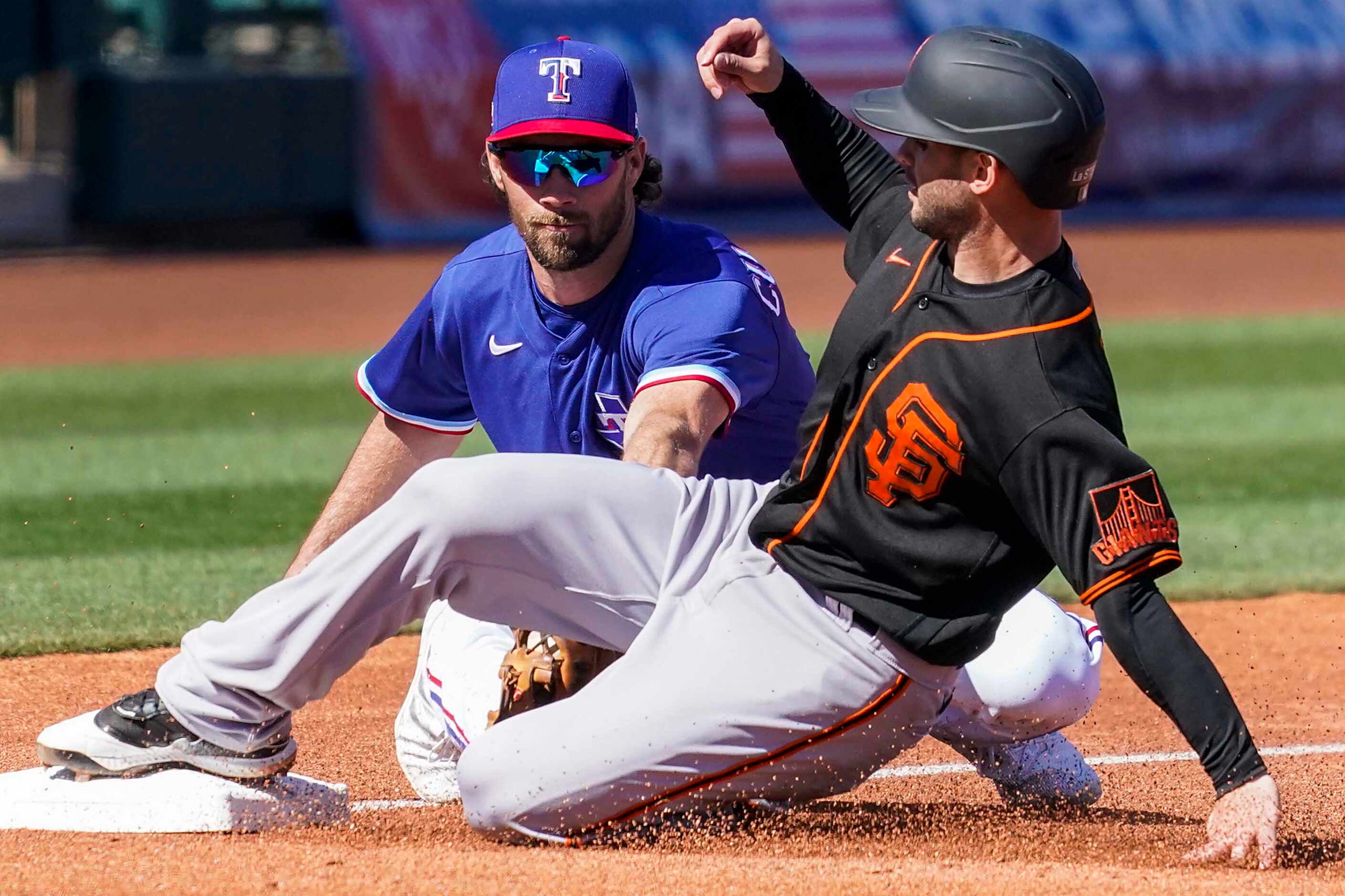 San Francisco Giants second baseman Tommy La Stella is safe at third base ahead of the tag...