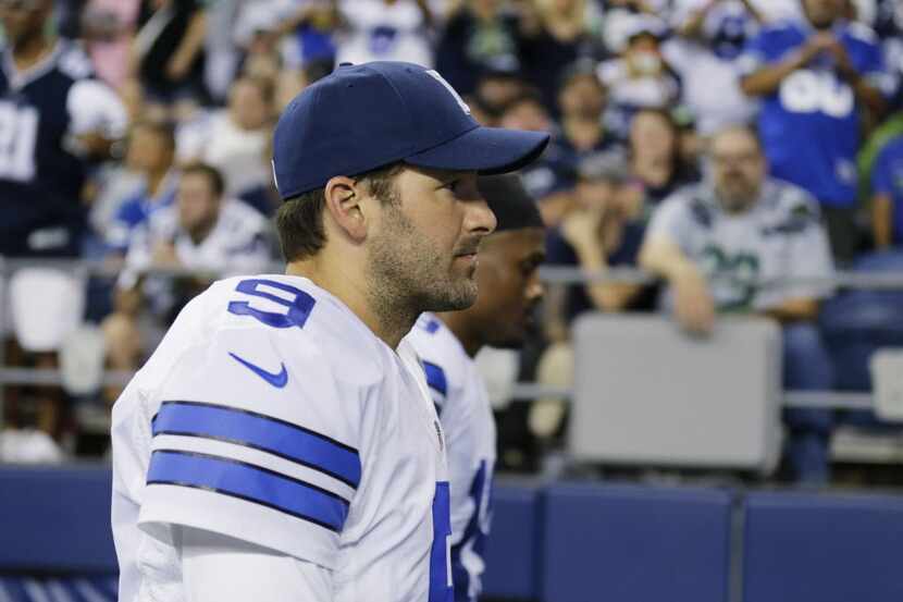 Dallas Cowboys quarterback Tony Romo walks off the field at half time of a preseason NFL...