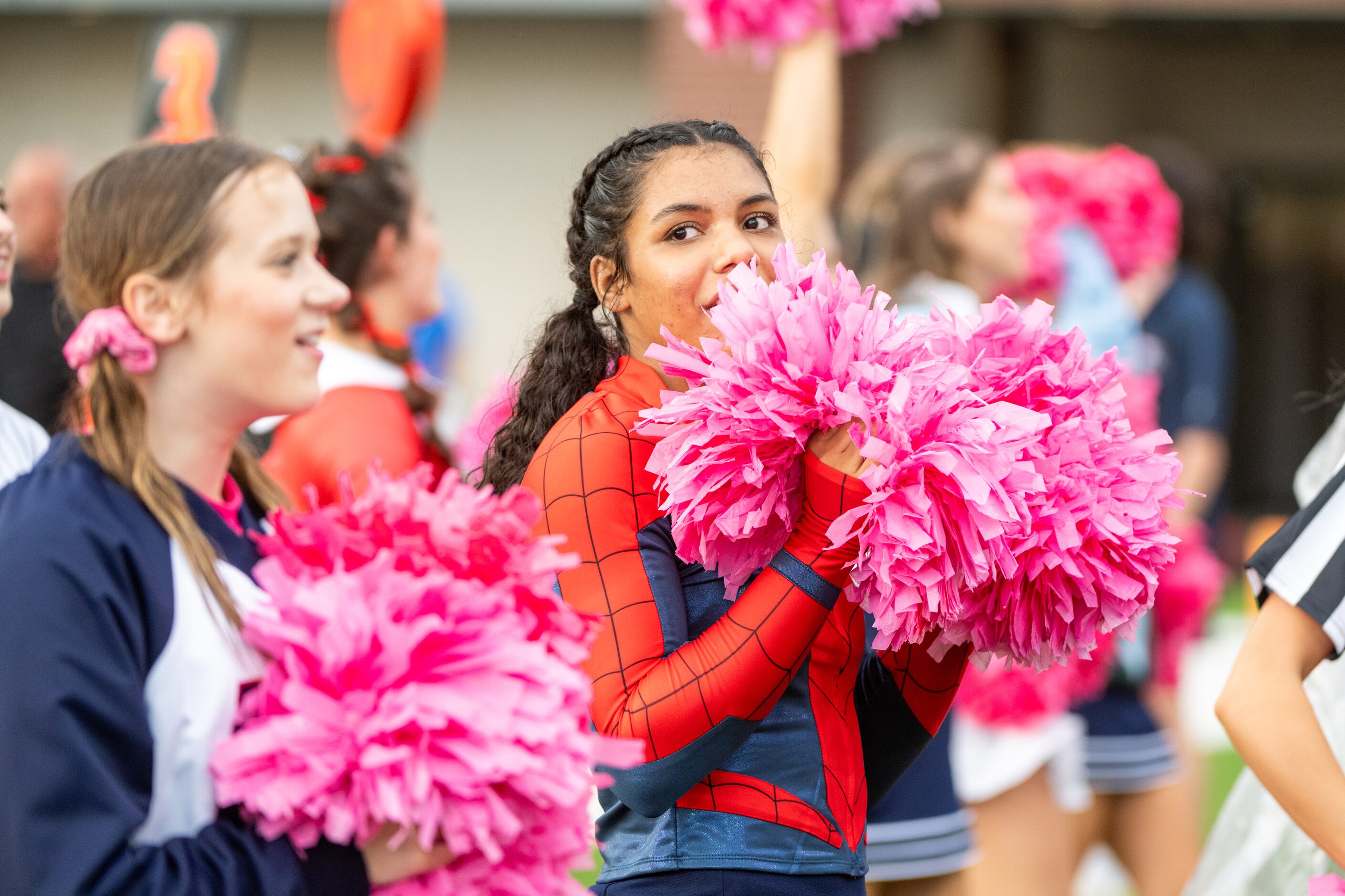 Allen cheerleaders perform in the first half during a high school football game between...