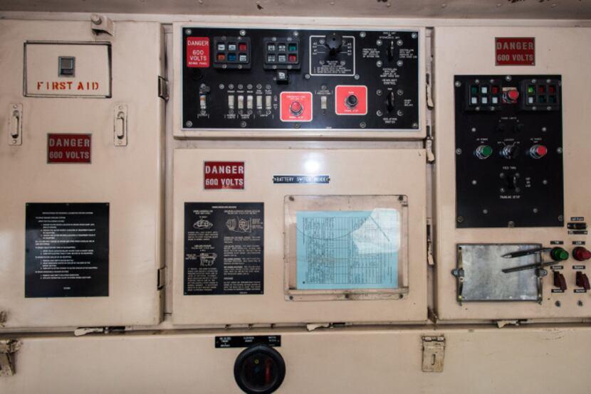 Signs on the back wall of the cab of the Royal Gorge Railroad Route warn of high voltage. In...