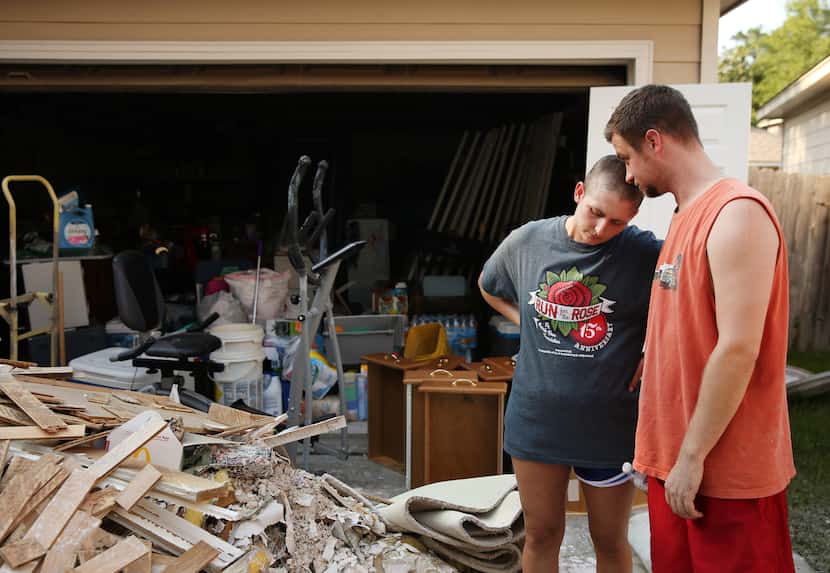 Josh and Sarah Dill were at home when they had to evacuate when flood waters entered their...