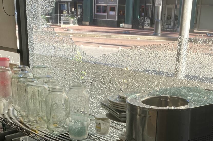 A portion of the damage to one of Cafe Momentum's large windows, which face Pacific Avenue,...