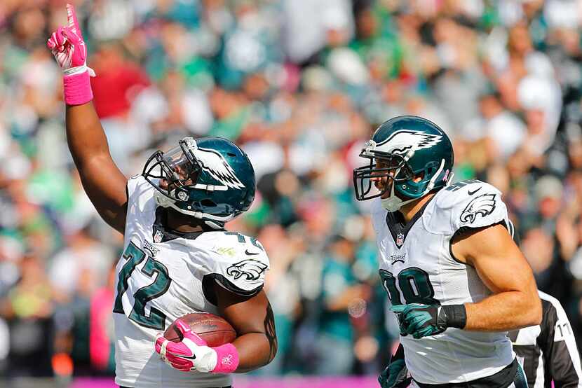 Cedric Thornton #72 and Connor Barwin #98 of the Philadelphia Eagles react after Thornton...