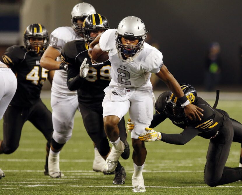 Denton Guyer High QB Jerrod Heard (2) runs away from San Antonio Northside defenders in...