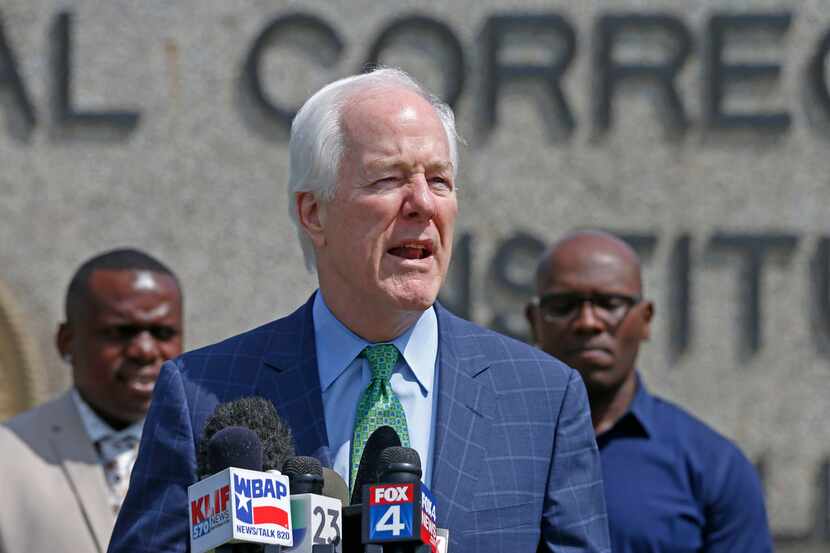 Sen. John Cornyn speaks outside the Federal Correctional Institute in Seagoville in May....