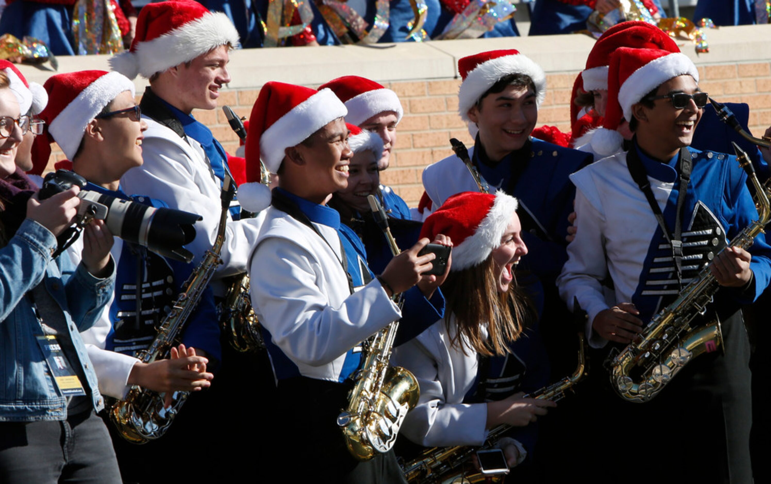 Members of the Allen band react to an Eagles touchdown drive against Euless Trinity in the...