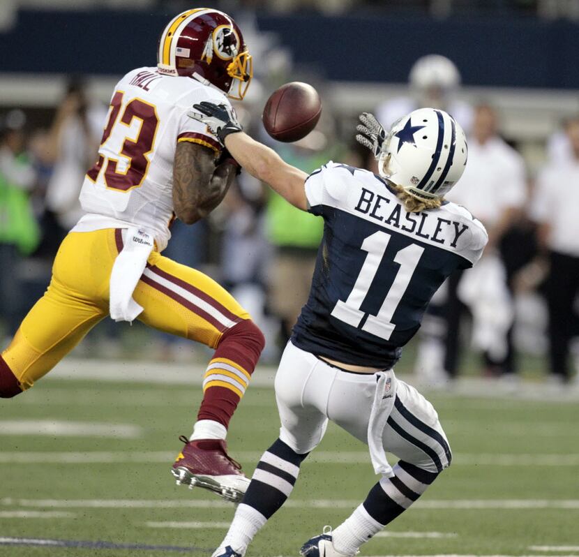 Washington Redskins cornerback DeAngelo Hall (23) intercepts a pass intended for Dallas...