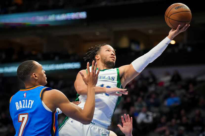 Dallas Mavericks guard Jalen Brunson (13) scores past Oklahoma City Thunder forward Darius...