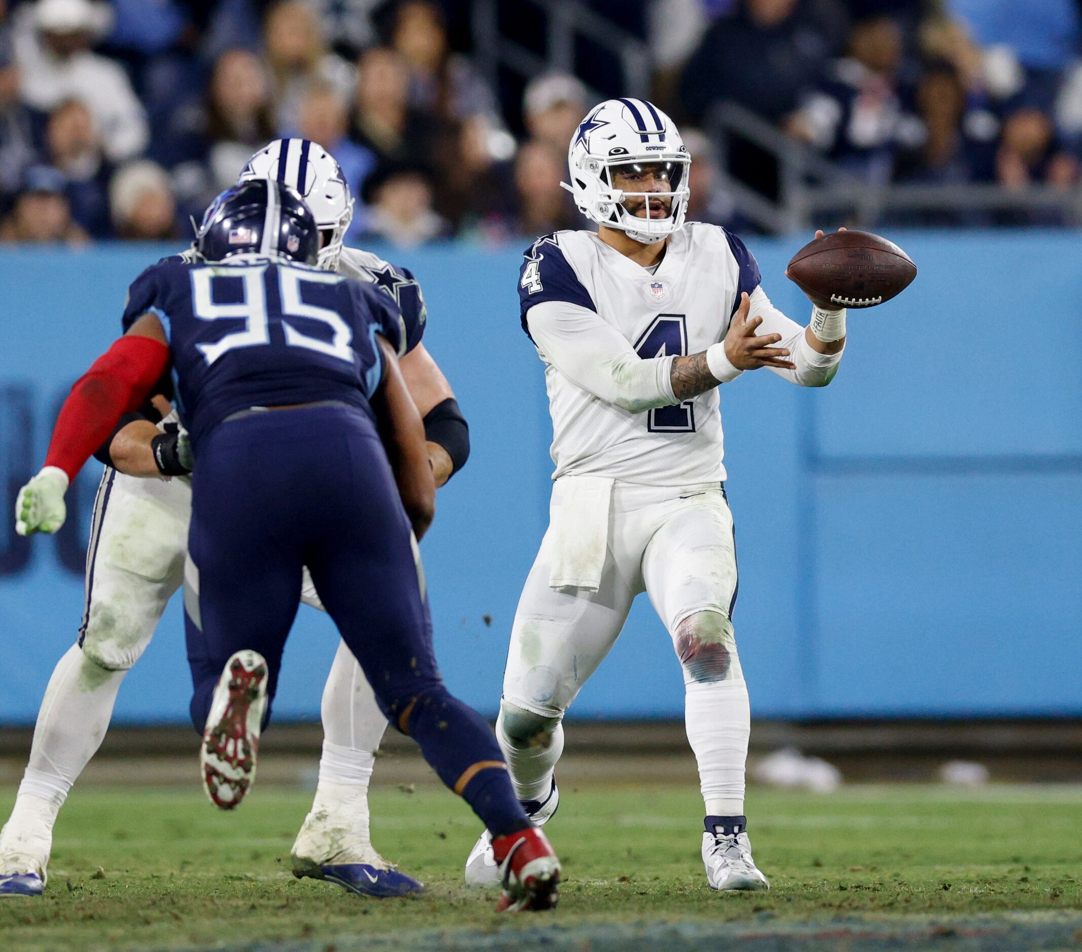 Dallas Cowboys quarterback Dak Prescott (4) handles a snap during the second half of an NFL...