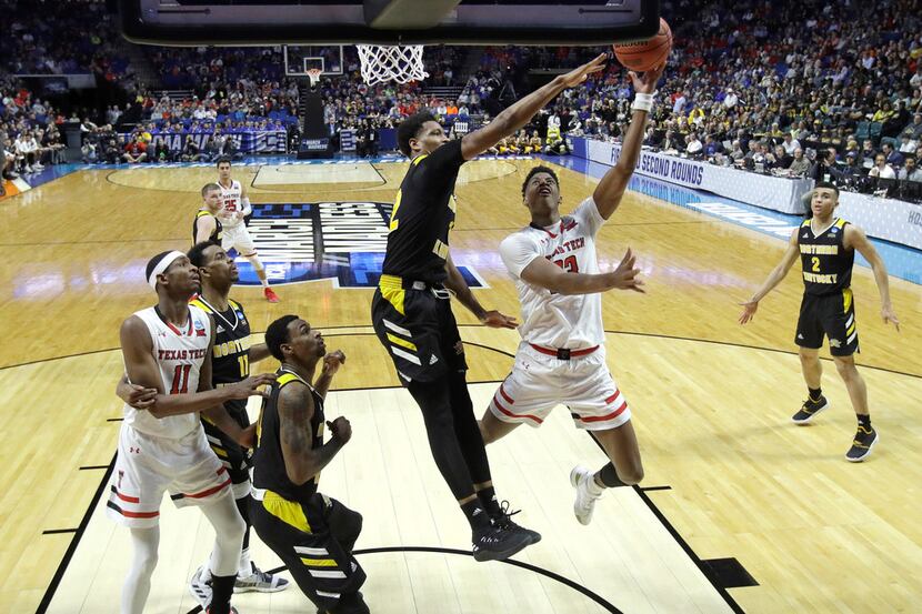 Texas Tech's Jarrett Culver puts up a shot under pressure from Northern Kentucky's Dantez...