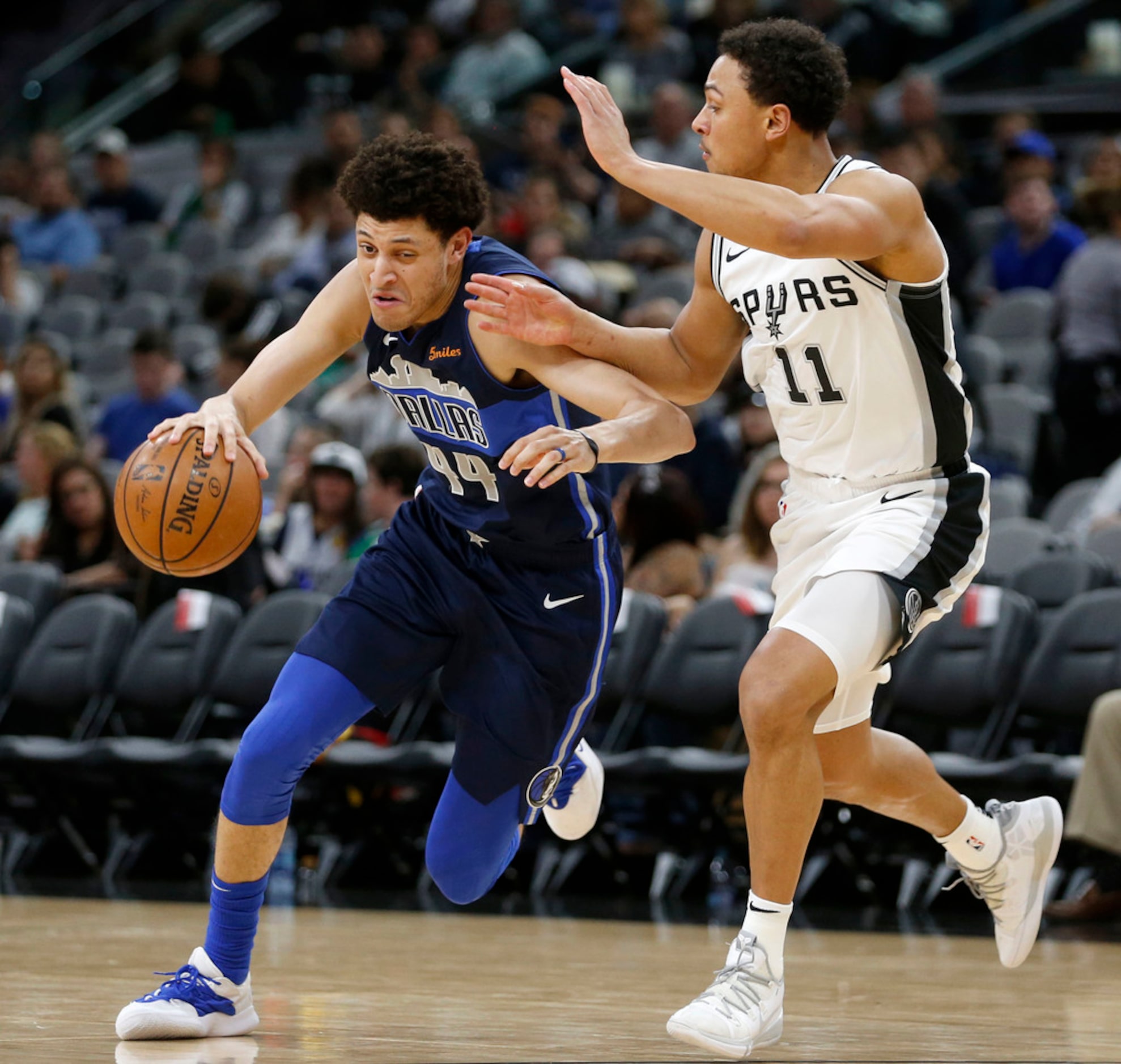 Dallas Mavericks forward Justin Jackson (44) drives around San Antonio Spurs guard Bryn...