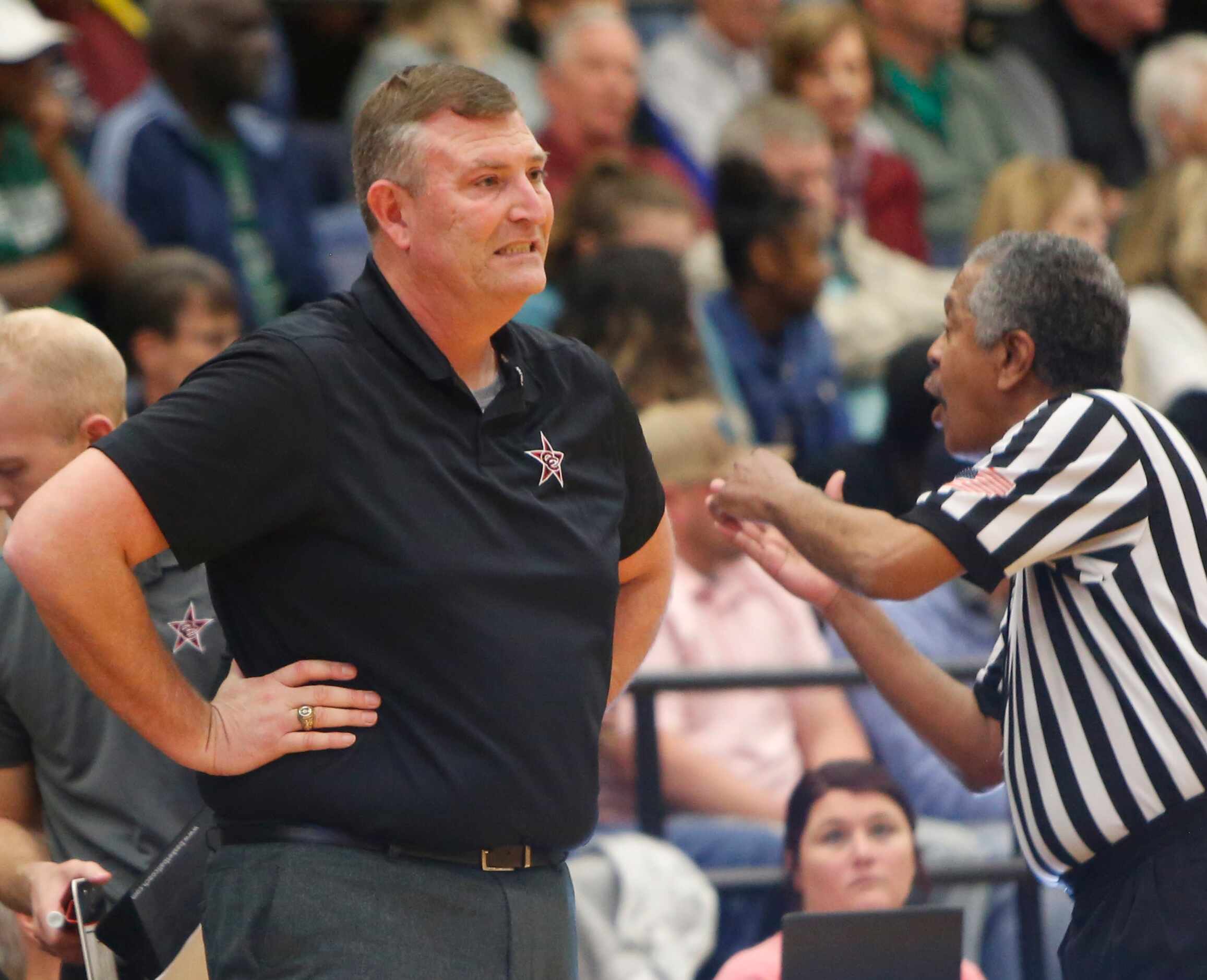 Coppell head coach Clint Schnell reacts after a foul was called against one of his players...