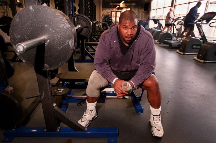 Dallas Cowboys lineman Larry Allen takes a break before bench pressing after a morning...