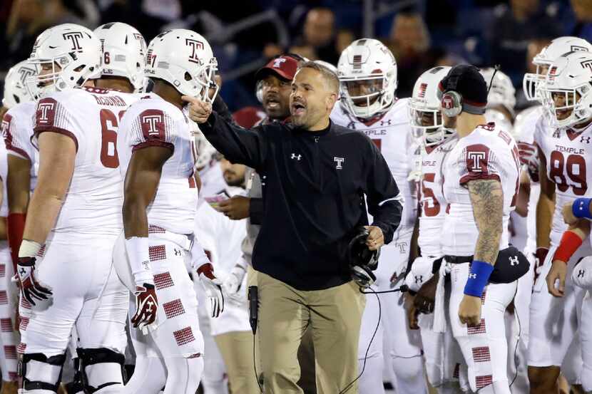 Temple coach Matt Rhule talks to his players during the first half of the team's NCAA...