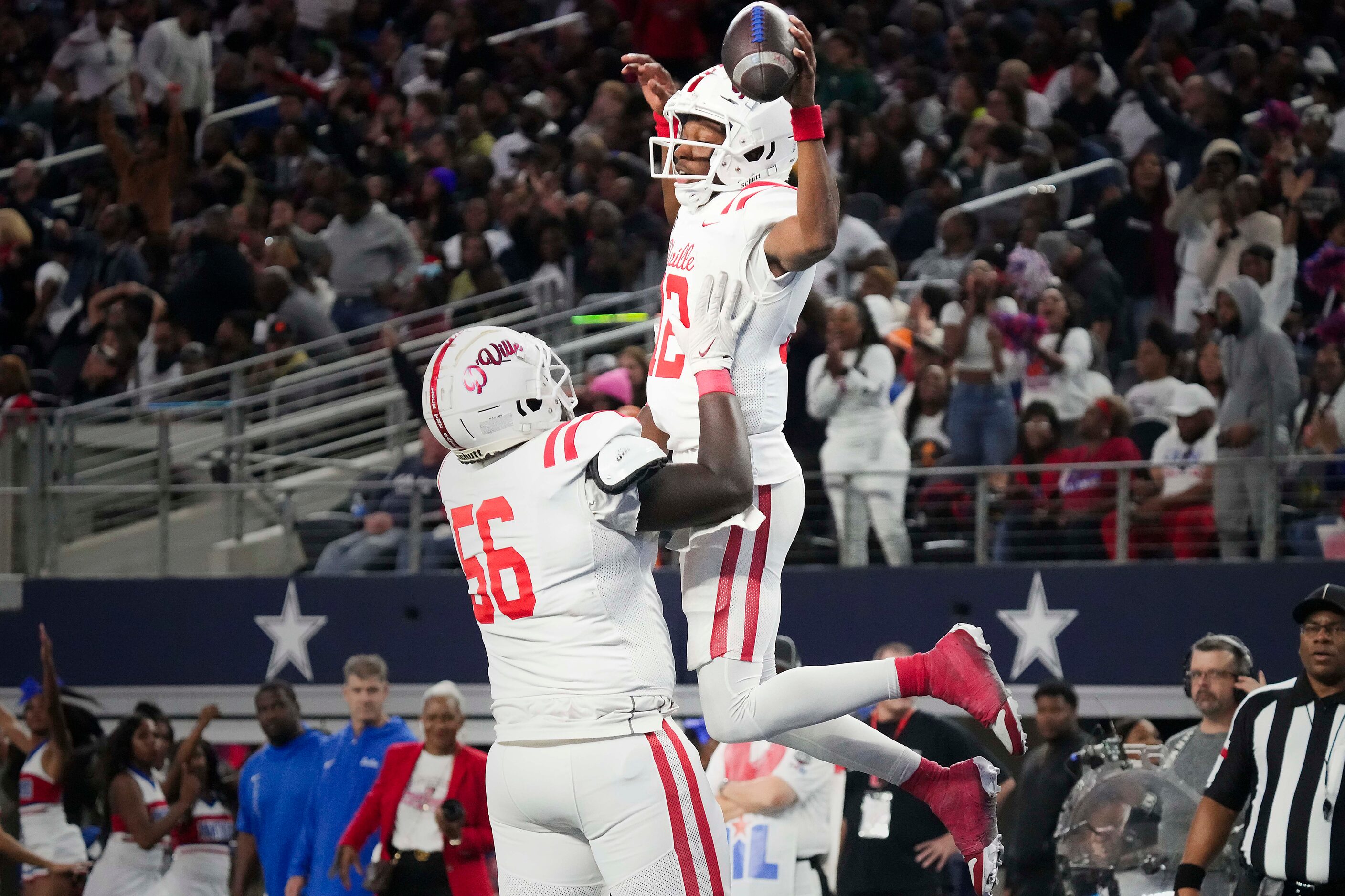 Duncanville quarterback Keelon Russell (12) celebrates with offensive lineman La'Rayvion...