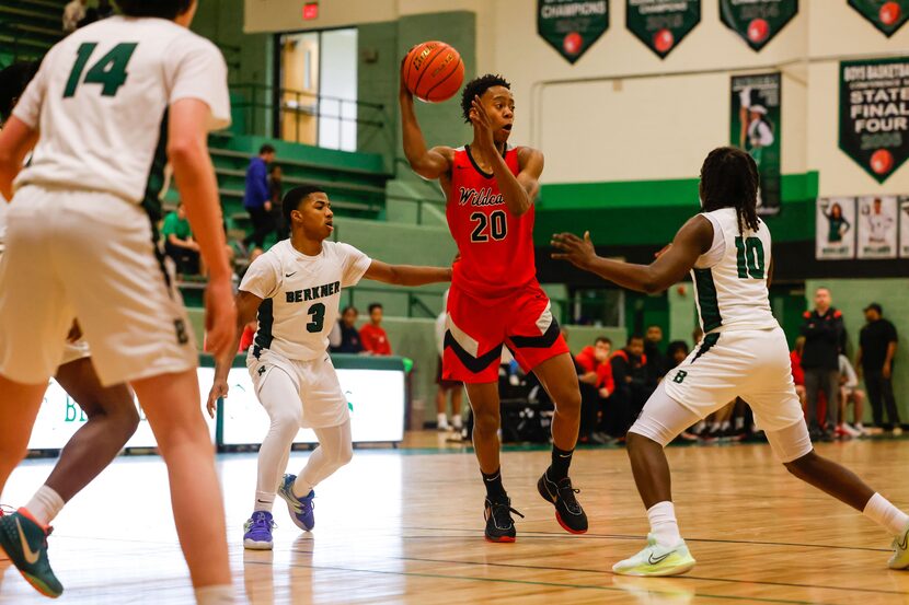 Lake Highlands High School' Tre Johnson #20, attempts a pass during a game against Berkner...