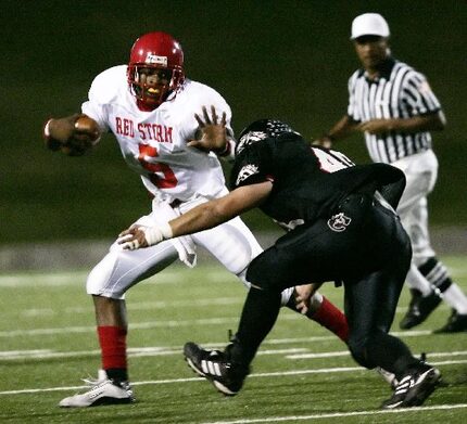 FILE - Carter quarterback Michael Crabtree #5 eludes Carrollton Creekview defender Jordon...