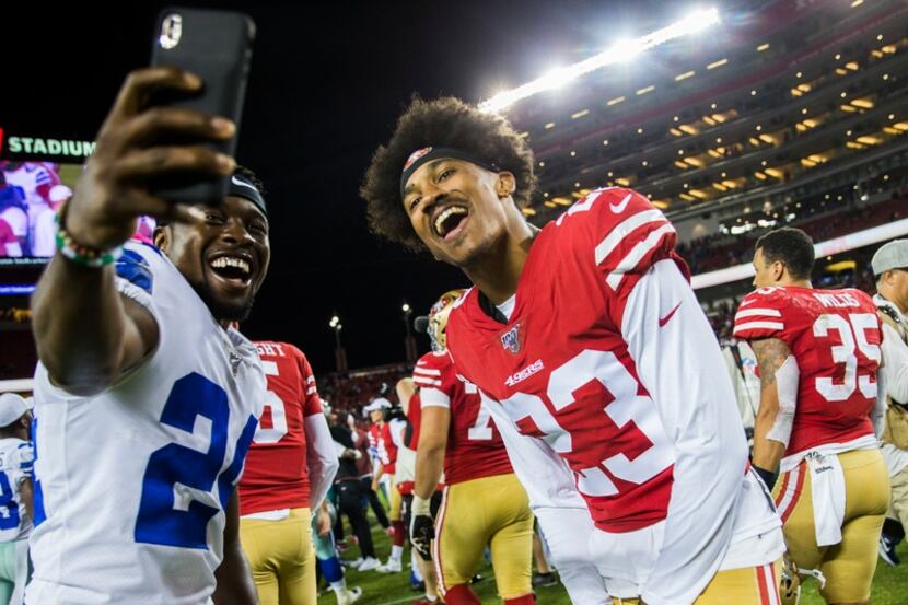 Dallas Cowboys cornerback Chidobe Awuzie (24) takes a selfie with San Francisco 49ers...