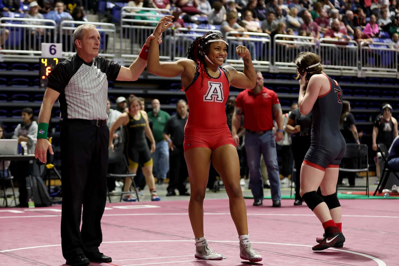 Jasmine Robinson (red) of Allen defeats Jaidin Perkawsky-Green of Euless Trinity in the...