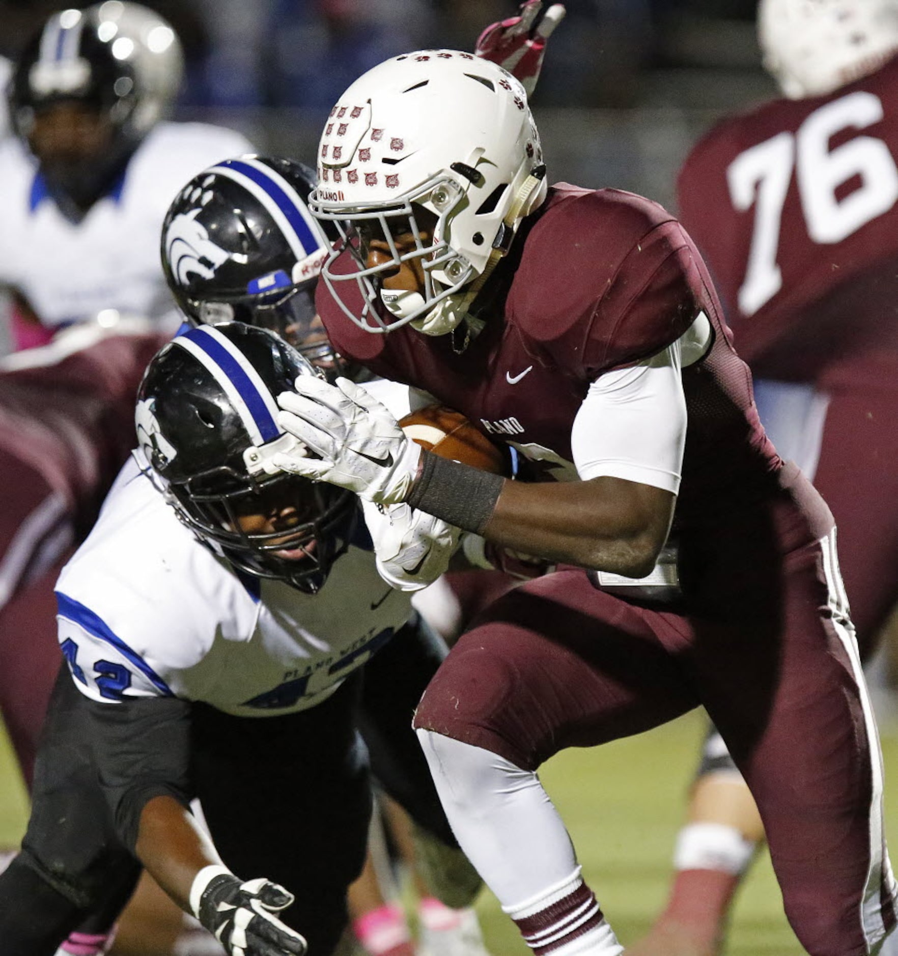 Plano High School running back Brandon Stephens (2) is tackled by Plano West High School...