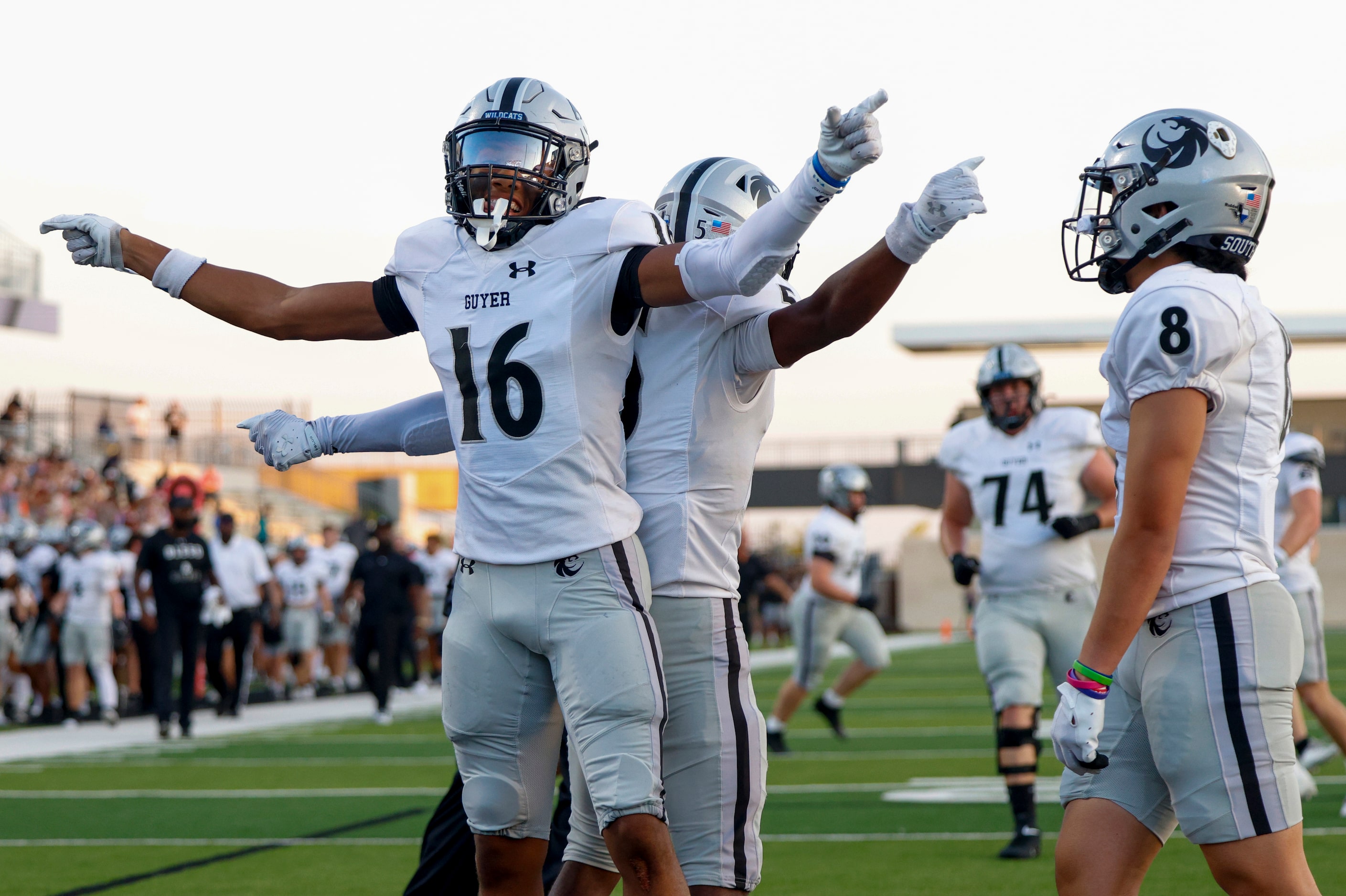 Denton Guyer wide receiver Mason White (16) celebrates his touchdown with teammates during...