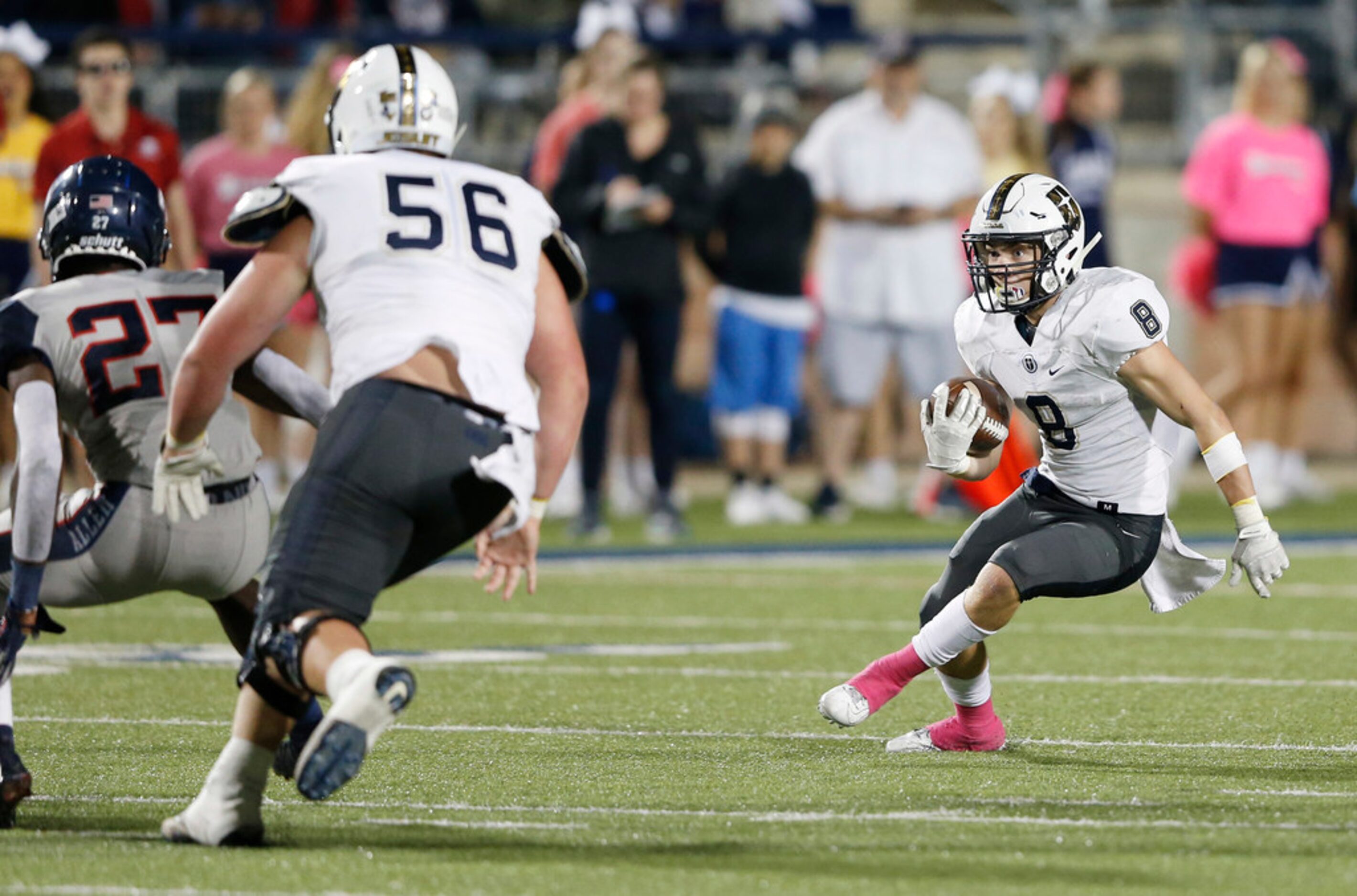 Jesuit's Jake Taylor (8) looks to run up the field in a game against Allen during the first...