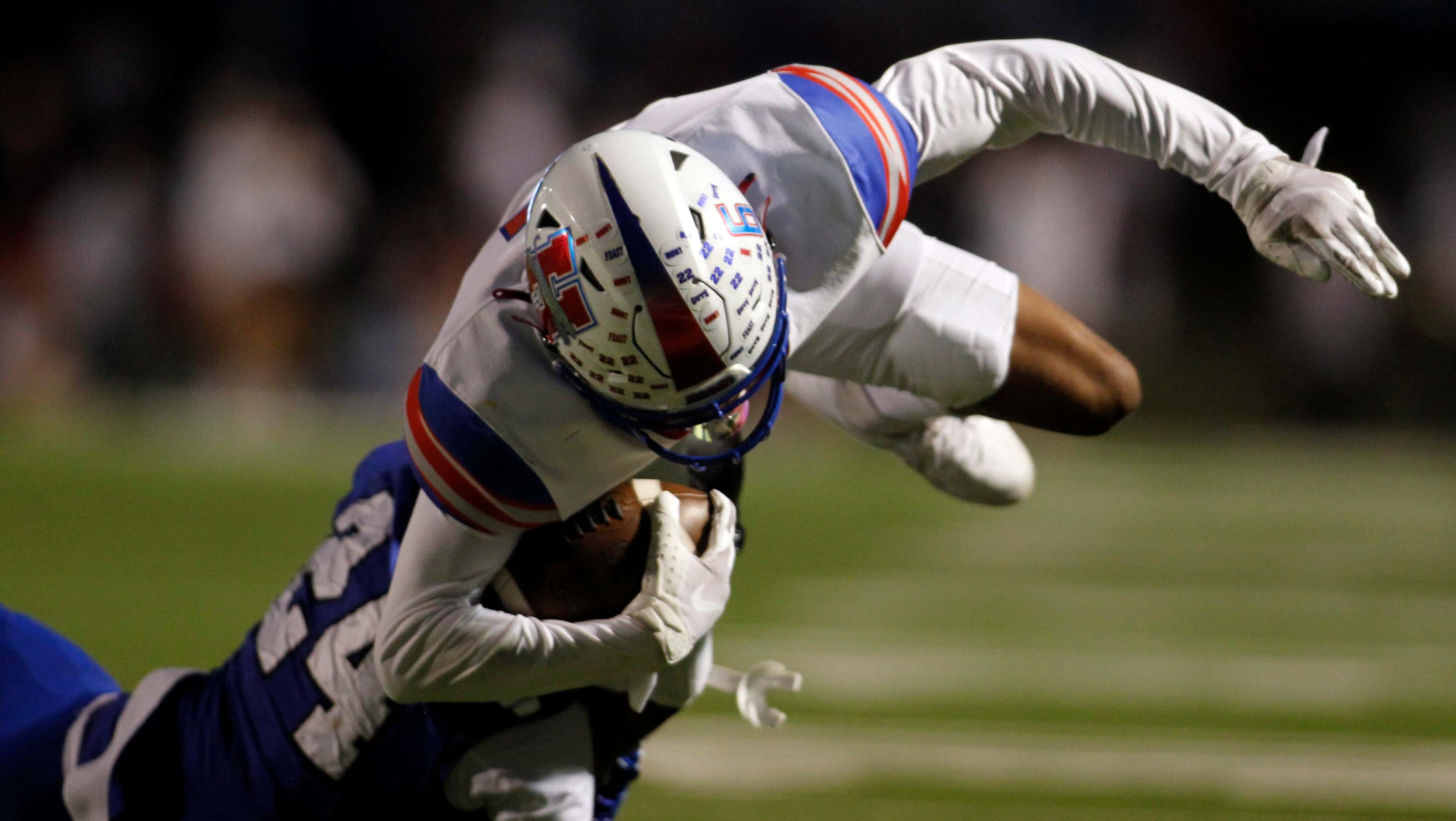 Midlothian Heritage receiver Freeman Robinson (6) is tackled short of the end zone by...
