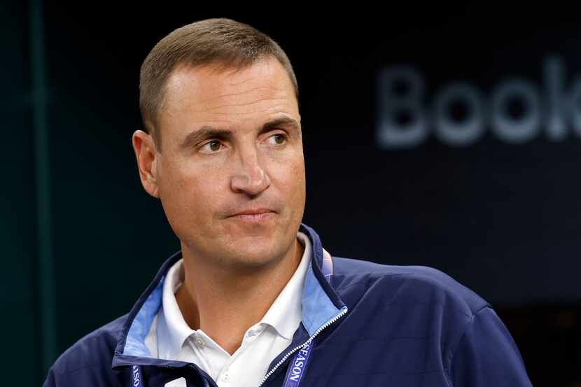 Texas Rangers general manager Chris Young watches his players during batting practice before...